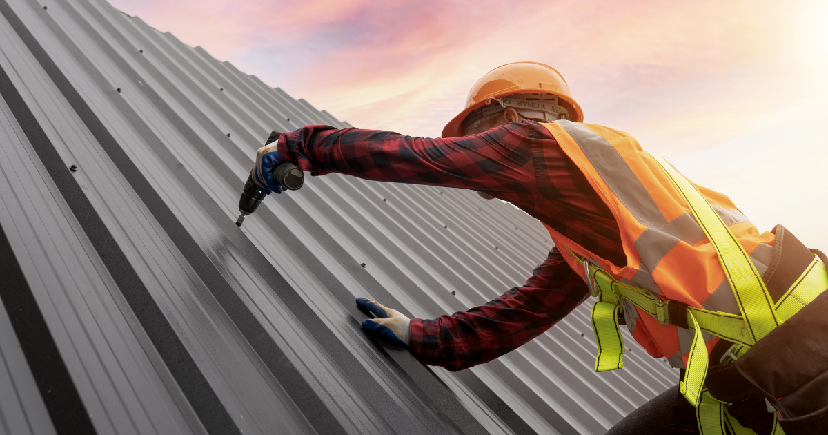 Roofer on top of roof.